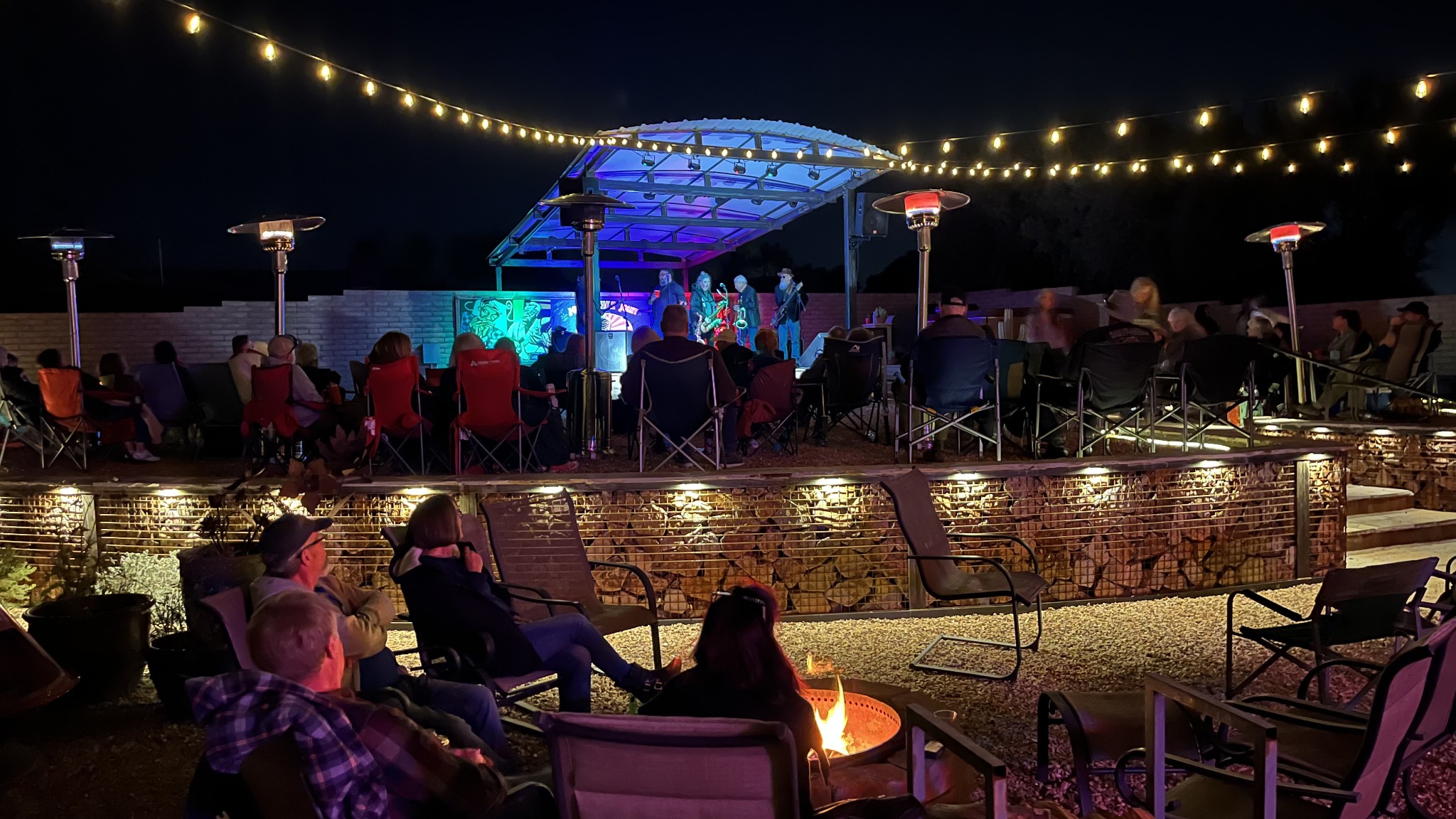 Guests enjoying a live nighttime concert at Jonas' Juke Joint